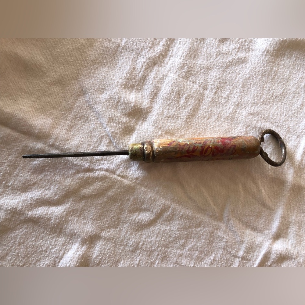 Vintage Coca Cola ice pick with metal bottle opener on top end